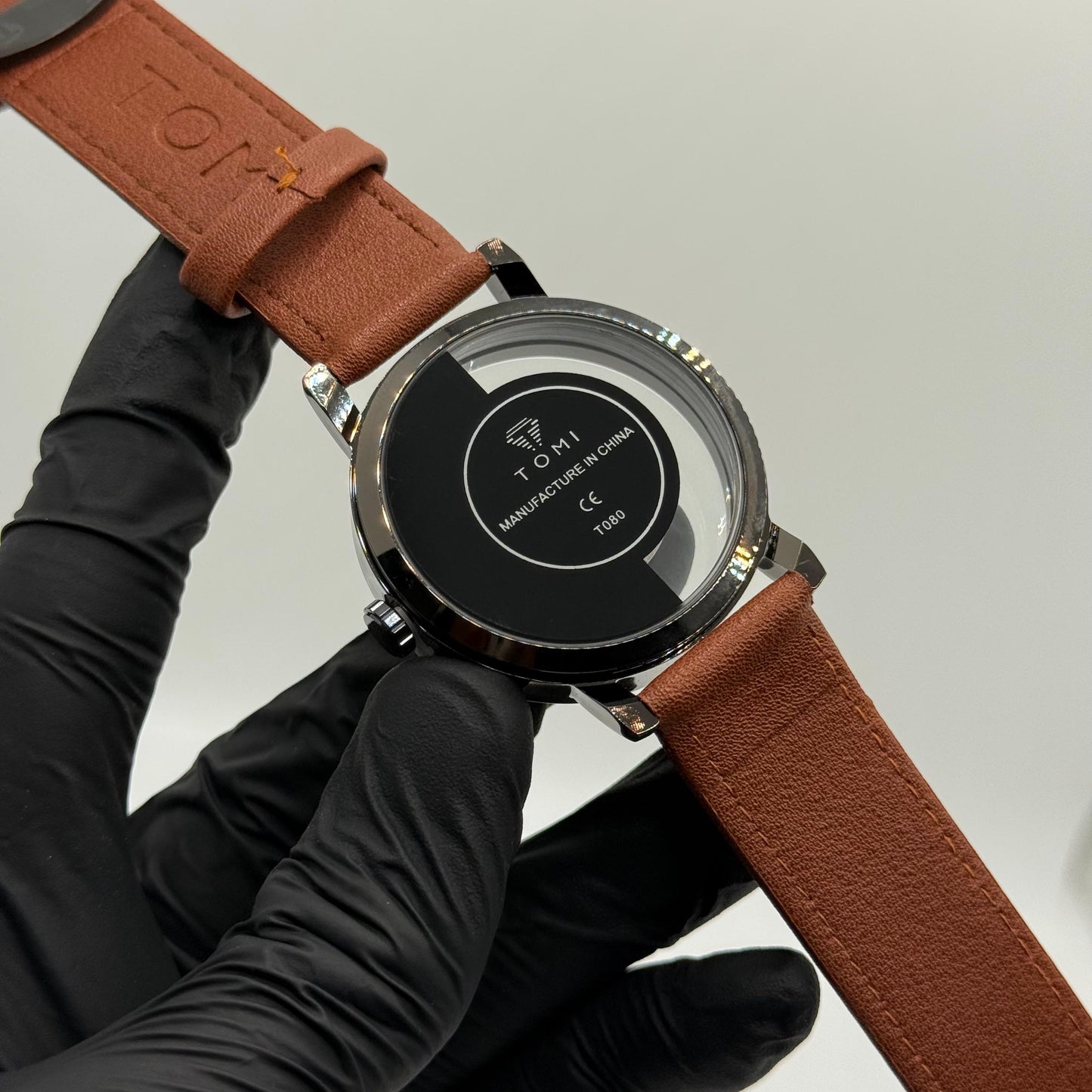 TOMI transparent dial with black leather strap