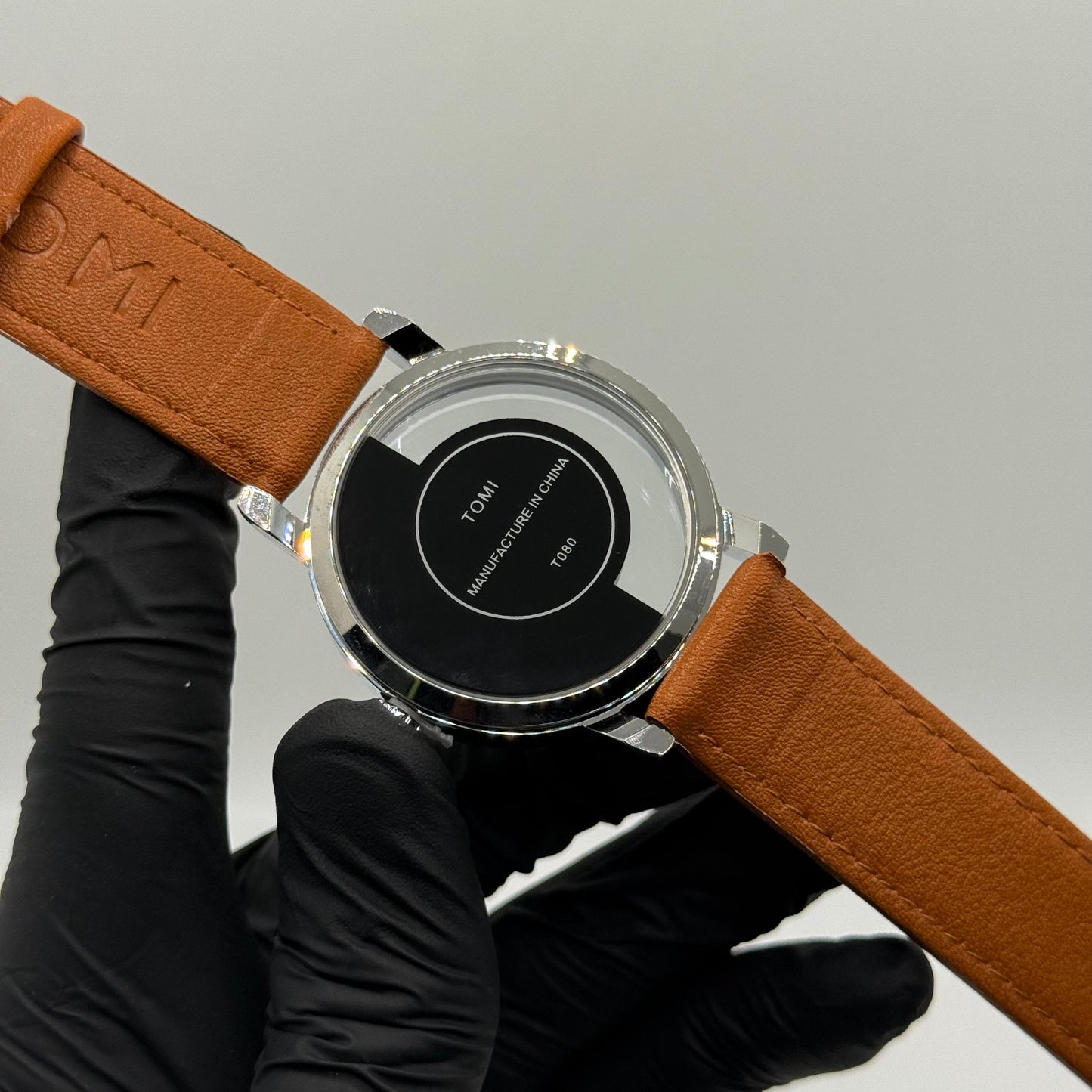 TOMI transparent dial with bronze leather strap