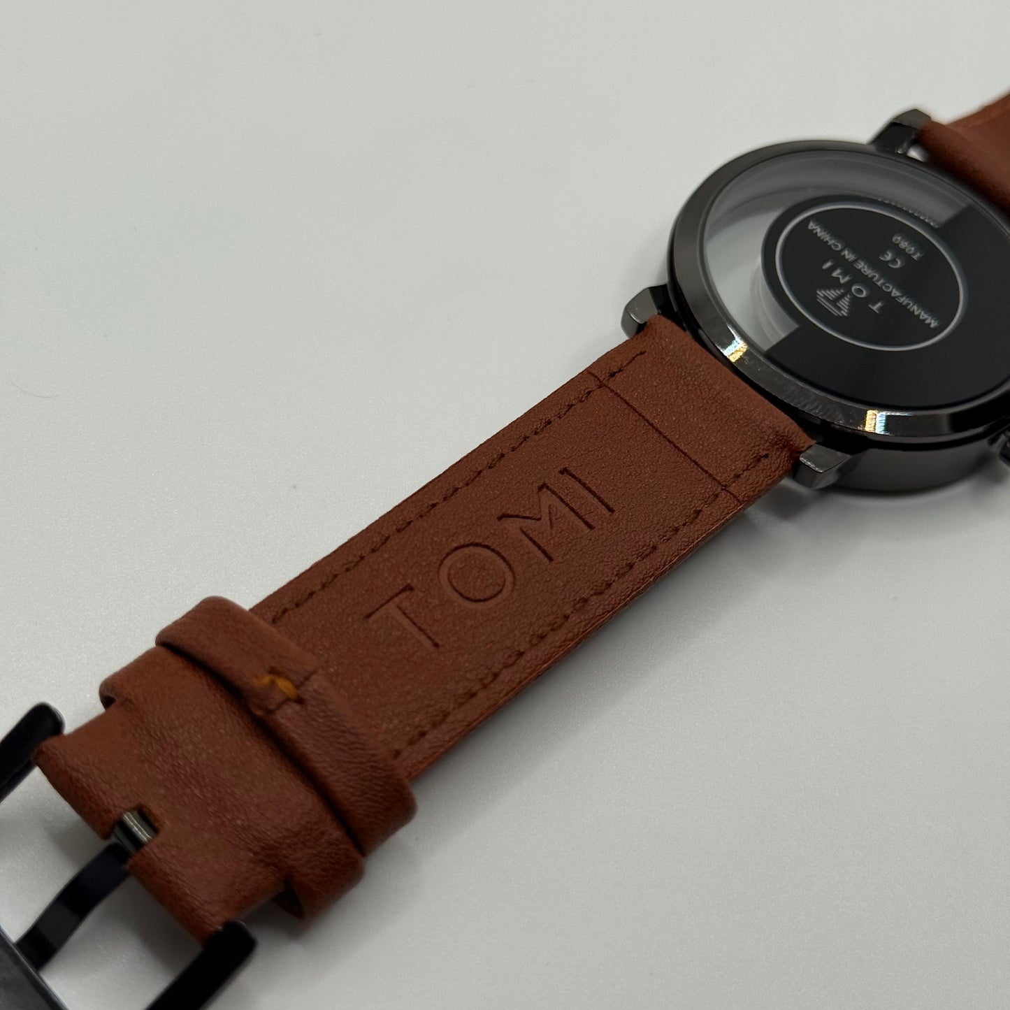 TOMI transparent dial with black leather strap